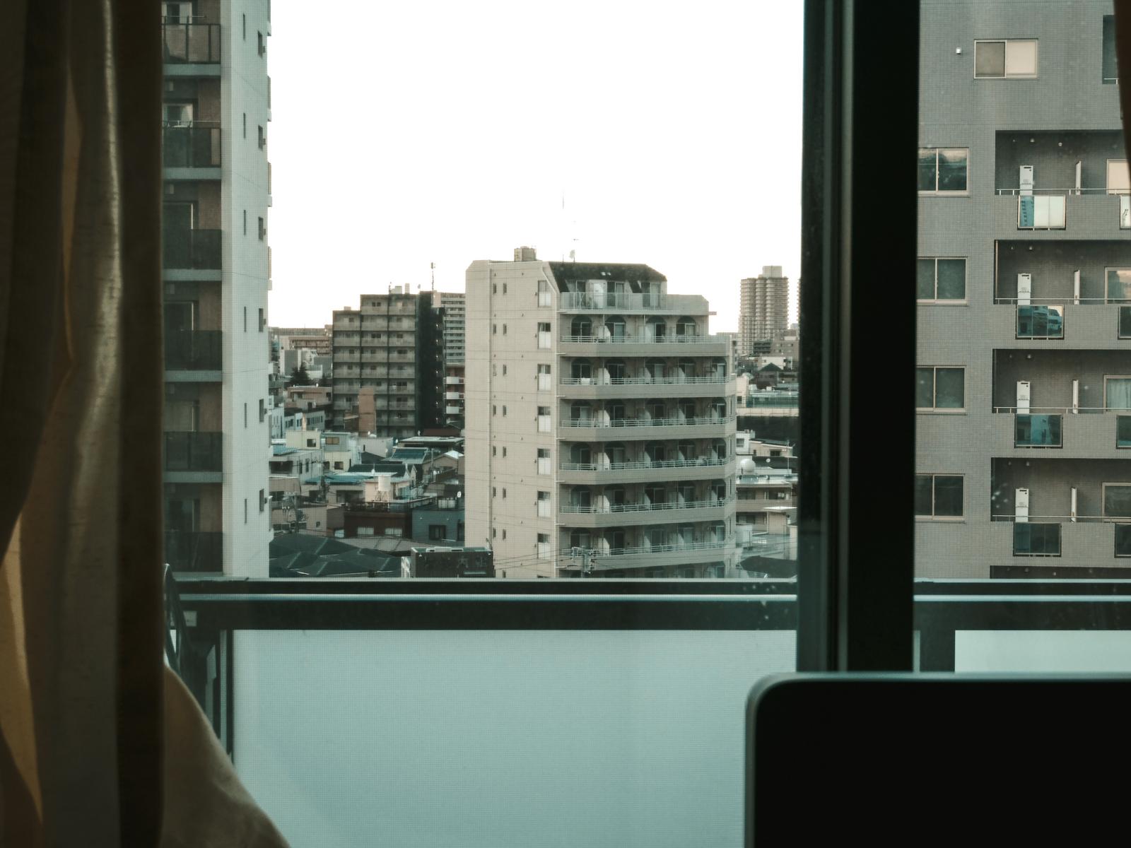 Smooth raises $4m. A Japanese apartment block seen through a window, a header image marking the piece as a funding story.