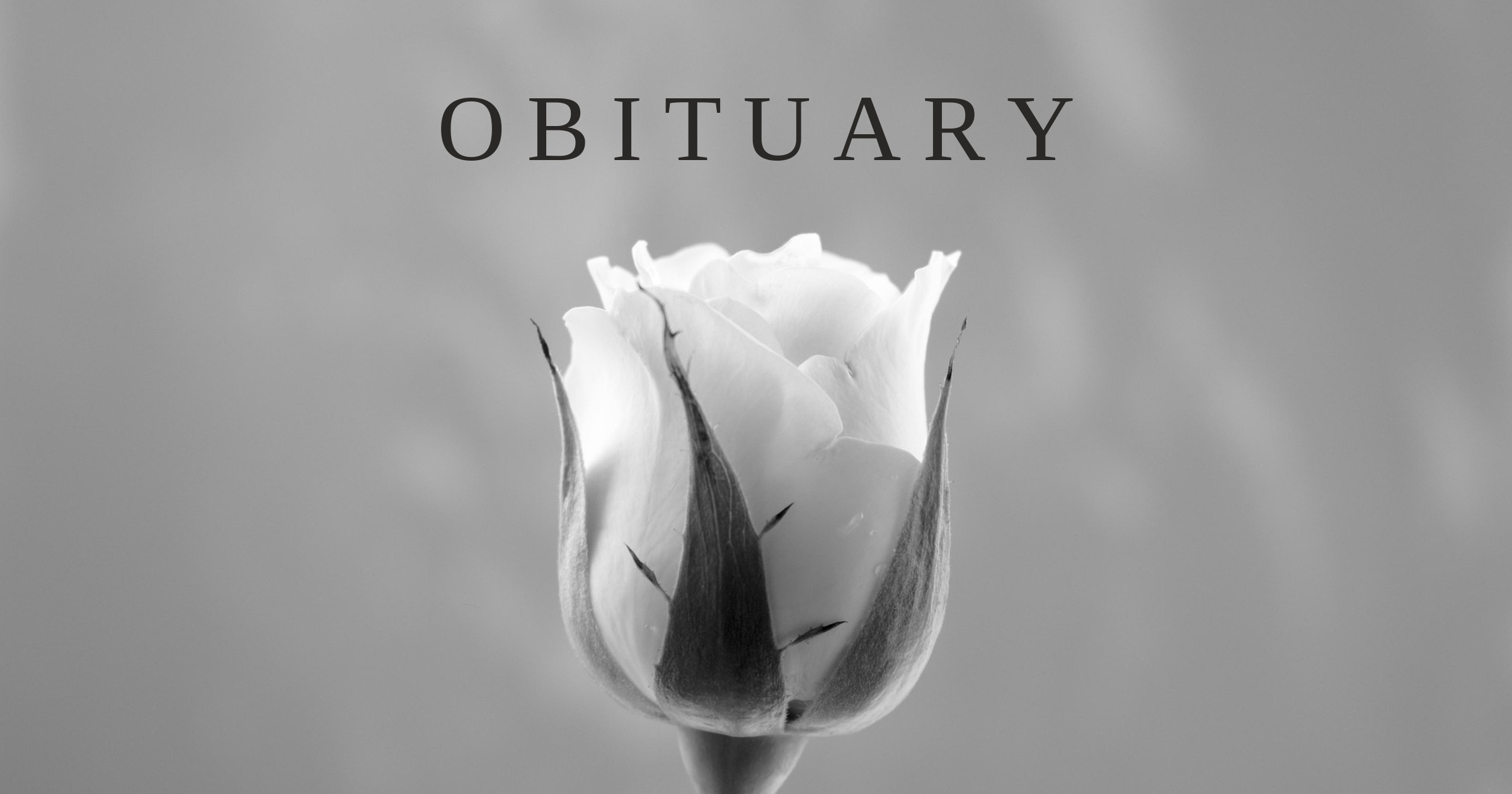 A featured image of white flowers with the word ‘Obituary’, marking the death of Hiroshi Tsukakoshi